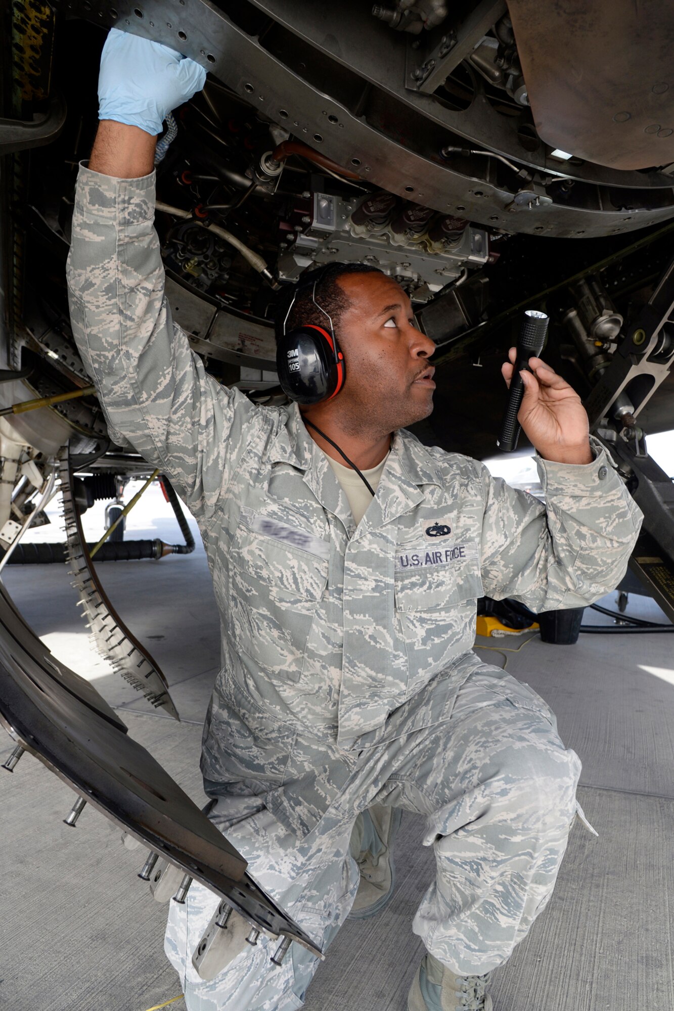 Tech. Sgt. Lawrence, Raptor Quality Assurance inspector, performs a Key Task Listing inspection on an F-22 Raptor at an undisclosed location in Southwest Asia Feb. 18, 2015. KTLs are inspection items that have been deemed so important from a quality perspective that it is mandatory that QA looks at them either while they are being conducted or immediately upon completion. Lawrence is currently deployed from Tyndall Air Force Base, Fla., and is a native of Detroit, Mich. (U.S. Air Force photo/Tech. Sgt. Marie Brown)