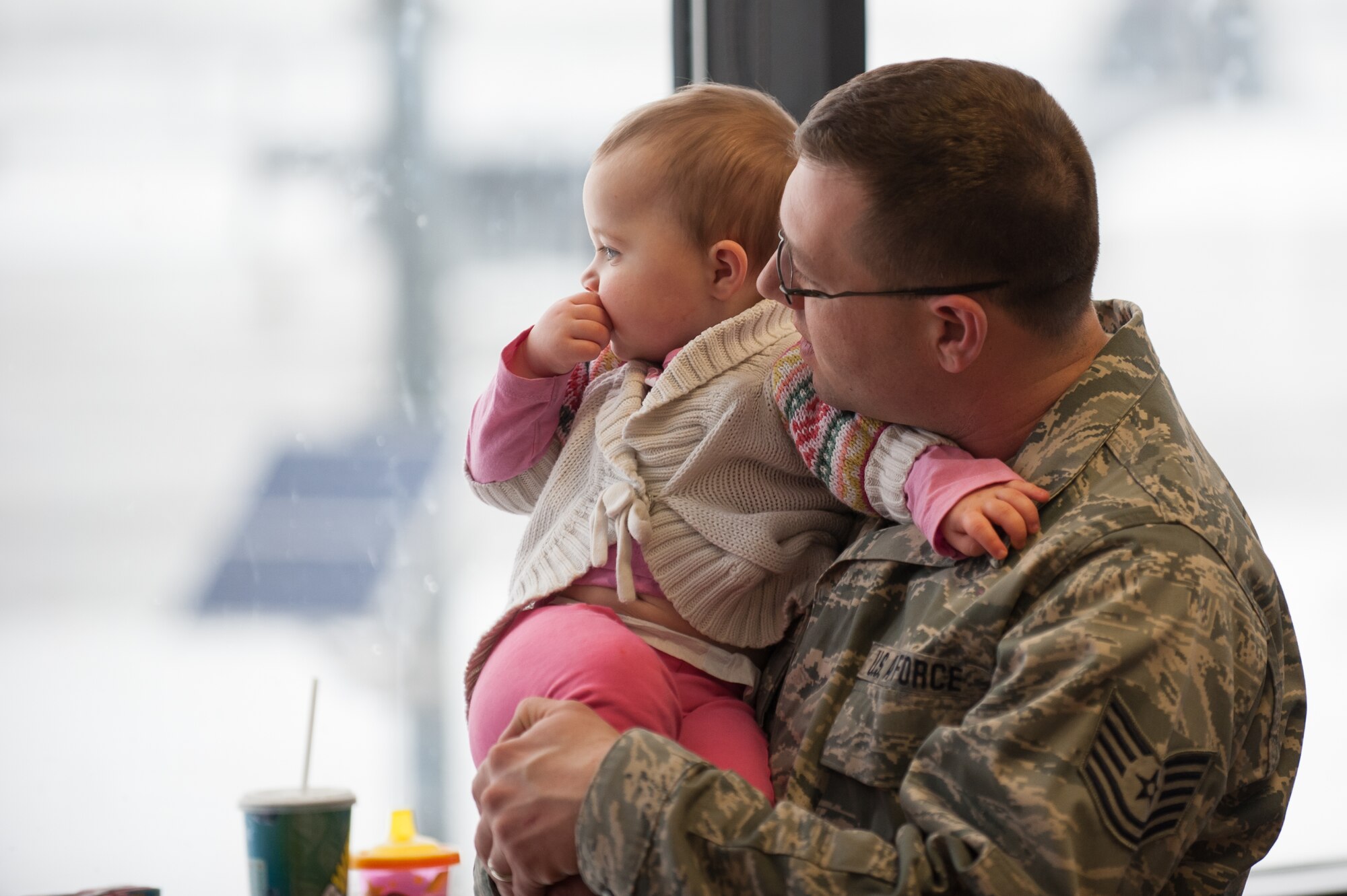Tech. Sgt. Lee Stanley, an aircraft structural engineer in the 123rd Airlift Wing, spends some quiet time with his daughter, Madelyn, at the Kentucky Air National Guard Base in Louisville, Ky., Feb. 21, 2015. Stanley is deploying to the Persian Gulf in support of Operation Freedom's Sentinel, during which more than 110 members of the Kentucky Air Guard will conduct an airlift mission to fly troops and cargo across the U.S. Central Command Area of Responsibility. (U.S. Air National Guard photo by Maj. Dale Greer)