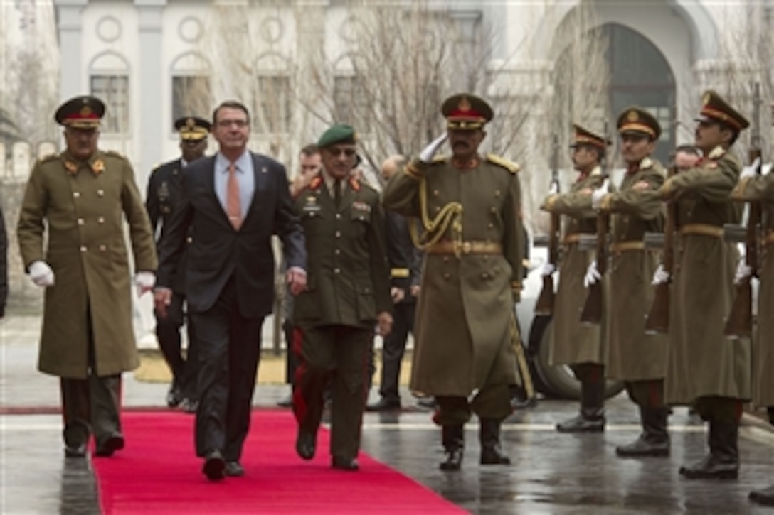 U.S. Defense Secretary Ash Carter walks through an honor cordon as he arrives at the presidential palace to meet with Afghan President Ashraf Ghani in Kabul, Afghanistan, Feb. 21, 2015. Carter also met with U.S. service members during his first trip to Afghanistan as secretary.