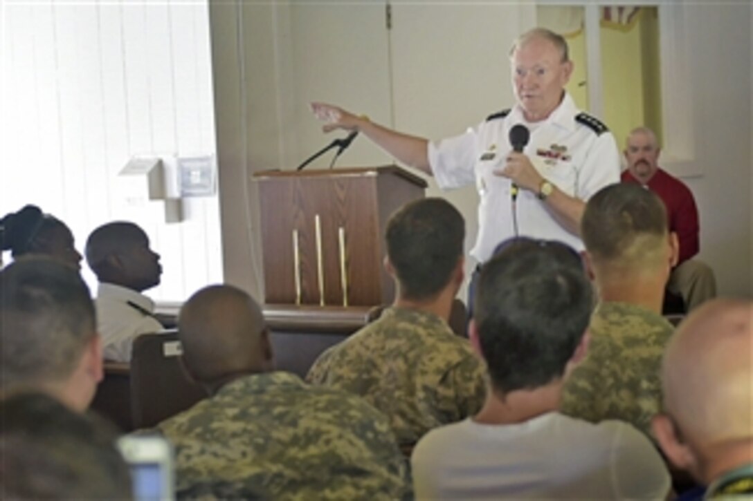 U.S. Army Gen. Martin E. Dempsey, chairman of the Joint Chiefs of Staff, hosts a town hall meeting with service members, Defense Department civilians and family members at Bucholz Army Airfield, Kwajalein Atoll, Marshall Islands, Feb. 21, 2015. Dempsey discussed a range of topics including sequestration and current conflicts. 