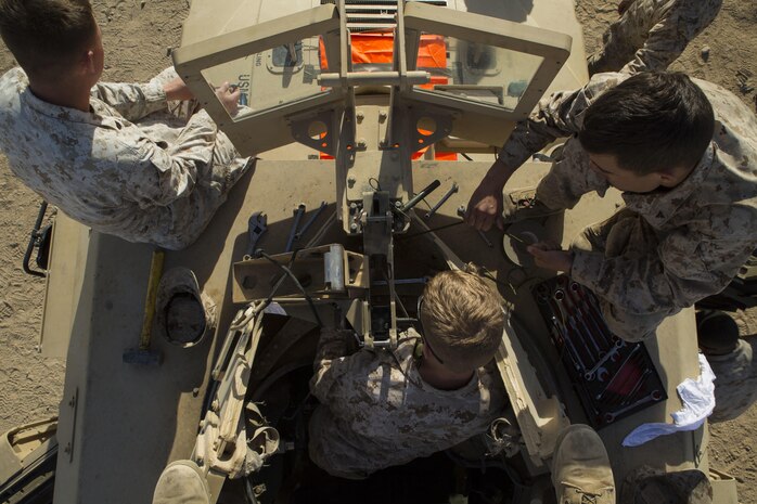 Marines fix the mount for a machine gun on one of the vehicles for the jump team Jan. 20 at Marine Air Ground Combat Center Twentynine Palms, California, during Integrated Training Exercise 2-15. The jump team uses M240B medium machine guns and the M2 .50-caliber Browning machine gun on their vehicles to provide security. ITX 2-15 is designed to integrate combined arms and improve warfighting capabilities. The Marines are with Headquarters Company, 4th Marine Regiment, 3rd Marine Division, III Marine Expeditionary Force. 