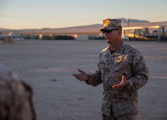Chief Warrant Officer 4 Craig E. Marshall talks to the jump team about his experiences in the Marine Corps Jan. 25 at Marine Air Ground Combat Center Twentynine Palms, California, during Integrated Training Exercise 2-15. The jump team received accolades from multiple units at ITX 2-15 and had been training since early January to improve their skills, according to Staff Sgt. Absalon A. Cabrera. ITX 2-15 is designed to integrate combined arms and improve warfighting capabilities. Marshall, a Marine Gunner, and Kansas City, Missouri, native, is the regimental gunner. Cabrera is an infantry unit leader, and Los Angeles, California, native. Both are with Headquarters Company, 4th Marine Regiment, 3rd Marine Division, III Marine Expeditionary Force. 