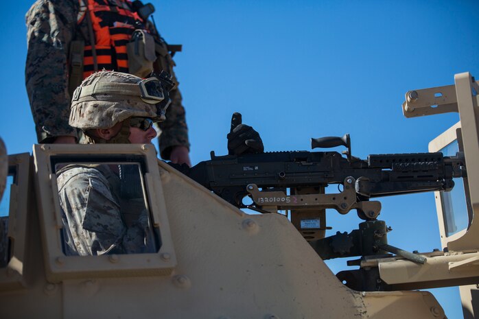Lance Cpl. Colin M. Weathers loads his M240B medium machine gun Jan. 26 at Marine Air Ground Combat Center Twentynine Palms, California, during Integrated Training Exercise 2-15. The jump team practices firing on a stationary range before moving to maneuvering and firing. ITX 2-15 is designed to integrate combined arms and improve warfighting capabilities. Weathers, a rifleman, and Brockton, Massachusetts, native is a gunner for the jump team with Headquarters Company, 4th Marine Regiment, 3rd Marine Division, III Marine Expeditionary Force.