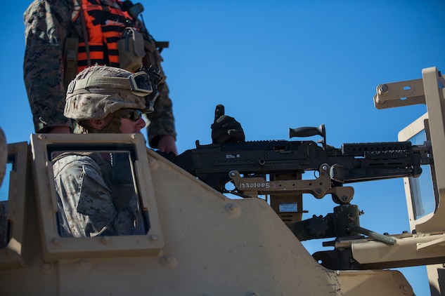 Lance Cpl. Colin M. Weathers loads his M240B medium machine gun Jan. 26 at Marine Air Ground Combat Center Twentynine Palms, California, during Integrated Training Exercise 2-15. The jump team practices firing on a stationary range before moving to maneuvering and firing. ITX 2-15 is designed to integrate combined arms and improve warfighting capabilities. Weathers, a rifleman, and Brockton, Massachusetts, native is a gunner for the jump team with Headquarters Company, 4th Marine Regiment, 3rd Marine Division, III Marine Expeditionary Force.