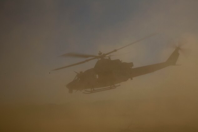 Col. David L. Odom and Cpl. Christopher J. Benavidez take off in a UH-1Y Venom helicopter to command the fight from the sky Feb. 12 at Marine Air Ground Combat Center Twentynine Palms, California, during the battalion assault course as part of Integrated Training Exercise 2-15. Benavidez provided Odom with communication to the supporting elements and the combat operations center during the flight. ITX 2-15 is designed to integrate combined arms and improve warfighting capabilities.  Benavidez, a Livermore, California, native, is a radio operator with Headquarters Company, 4th Marine Regiment, 3rd Marine Division, III Marine Expeditionary Force. Odom, a Hartsville, South Carolina, native, is the commanding officer for 4th Marines and Special Purpose Marine Air-Ground Task Force Four during ITX 2-15. 