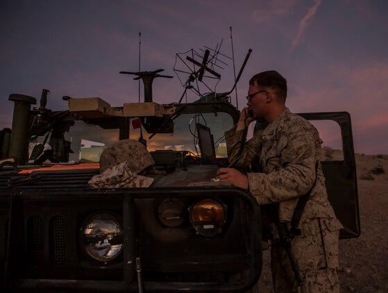 Lance Cpl. Joseph A. Daniel provides communication radio checks for the forward element of the combat operations center during the battalion assault course Feb. 12 at Marine Air Ground Combat Center Twentynine Palms, California, as part of Integrated Training Exercise 2-15. Marines part of the jump team must not only uphold their responsibilities on the jump, but also be able to do their job with Headquarters Company as well. ITX 2-15 is designed to integrate combined arms and improve warfighting capabilities. Daniel, a Danielsville, Georgia, native, and a radio operator, is with Headquarters Company, 4th Marine Regiment, 3rd Marine Division, III Marine Expeditionary Force. 