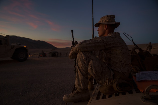 Lance Cpl. Bradley W. Walsh finally gets to relax after a long day of traveling across the rough terrain of the Mojave desert Feb. 12 at Marine Air Ground Combat Center Twentynine Palms, California, during Integrated Training Exercise 2-15. Walsh leads fellow junior Marines during ITX 2-15 as the assistant convoy commander for the jump team. “It’s awesome to get all the responsibility thrown on you,” said Walsh. ITX 2-15 is designed to integrate combined arms and improve war fighting capabilities. Walsh, a Granville, Ohio, native, and rifleman, is with Headquarters Company, 4th Marine Regiment, 3rd Marine Division, III Marine Expeditionary Force.