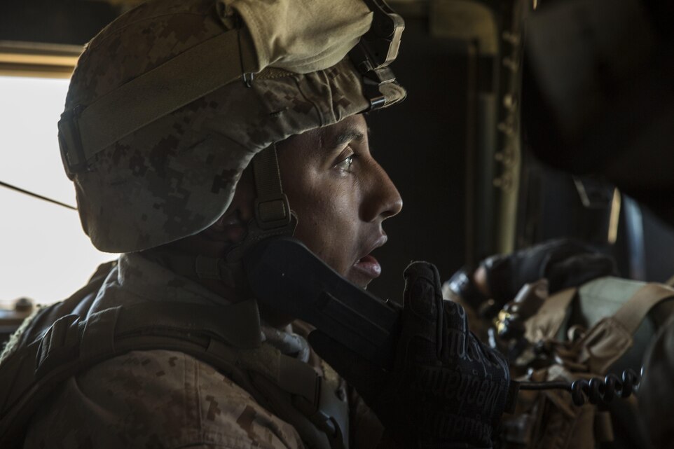 Staff Sgt. Absalon A. Cabrera uses a radio to communicate with the 4th Marine Regiment’s combat operations center while transporting the commanding officer across the battle space Feb. 12 at Marine Air Ground Combat Center Twentynine Palms, California, during the battalion assault course as part of Integrated Training Exercise 2-15. “I am very proud of all of my Marines,” said Cabrera. “They have accomplished a lot and it has been seen at different levels out here.” ITX 2-15 is designed to integrate combined arms and improve war fighting capabilities. Cabrera, a Los Angeles, California, native and an infantry unit leader, is the jump team commander for Special Purpose Marine Air-Ground Task Force Four with Headquarters Company, 4th Marine Regiment, 3rd Marine Division, III Marine Expeditionary Force. 