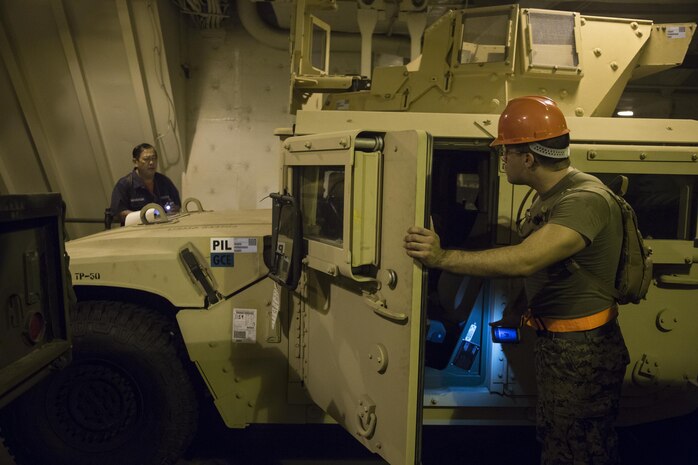 U.S. Marine Corps Lance Cpl. Manuel Leon, motor transportation operator, with Comb at Logistics Battalion 4, Combat Logistics Regiment 3, 3d Marine Logistics Group, conducts inventory aboard the U.S.N.S. Pililaau, Feb. 7, 2015. The Marines will be traveling to Thailand via the U.S.N.S. Pililaau in support of Exercise Cobra Gold 2015. The U.S.N.S. Pililaau provided transportation of equipment to support Exercise Cobra Gold 2015 due to the loss of support from the U.S.N.S. Kocak. (U.S. Marine Corps photo by MCIPAC Combat Camera Lance Cpl. Sergio RamirezRomero/Released)
