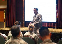 Maj. Thomas McNab, 62nd Airlift Wing deputy staff judge advocate, starts the three-hour training on the legal facts of sexual assault workshop at the McChord Field Club, Joint Base Lewis-McChord, Wash., Feb. 19, 2015. More than 50 commanders, chiefs, first sergeants and senior NCO's, representing five major commands, attended the training on what every leader needs to know about this topic. (U.S. Air Force photo/Senior Airman Rebecca Blossom)