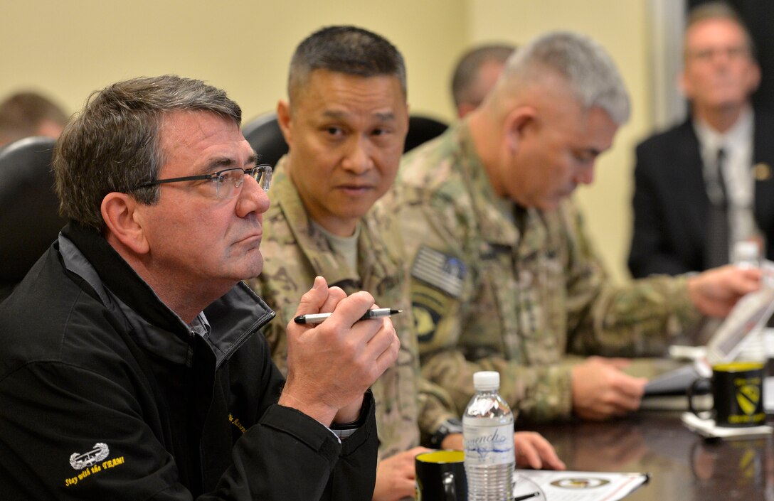 U.S. Army Brig. Gen. Viet Luong, commander of Train, Assist, Advise Command South, briefs U.S. Defense Secretary Ash Carter on operations in the region during Carter’s visit to Kandahar Airfield, Afghanistan, Feb. 22, 2015.