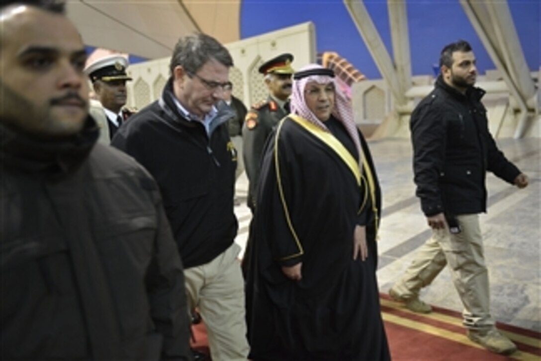 U.S. Defense Secretary Ash Carter talks with Kuwaiti Deputy Prime Minister and Defense Minister Sheikh Khalid al-Jarrah al-Sabah after arriving in Kuwait City, Feb. 22, 2015.  
