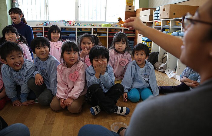 Volunteers from Marine Corps Air Station Iwakuni, Japan, teach the English alphabet to Midoro Hoikuen students during a community relations preschool event in Iwakuni City, Feb. 19, 2015. Coordinated by the Marine Memorial Chapel aboard station, volunteers spent the morning dancing, singing, learning and playing with the Japanese children. The chapel coordinates multiple COMREL events each month to give MCAS Iwakuni personnel a chance to be part of the growing relationship between the station and community.