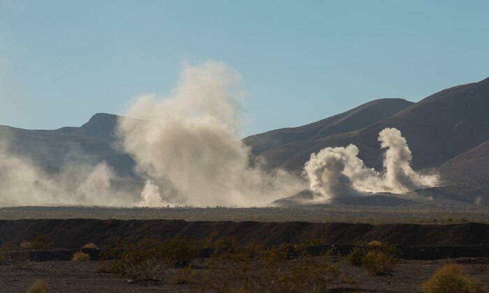 Air and ground combat elements provide suppressing fire for other ground units to move to assault objectives Feb. 9 during the battalion assault course at Marine Air Ground Combat Center Twentynine Palms, California, at Integrated Training Exercise 2-15. The BAC at ITX 2-15 is designed to incorporate all elements of the Special Purpose Marine Air-Ground Task Force Four into one assault. Marines firing artillery, as suppressive fire, are with 1st Battalion, 12th Marine Regiment, 3rd Marine Division, III Marine Expeditionary Force. 
