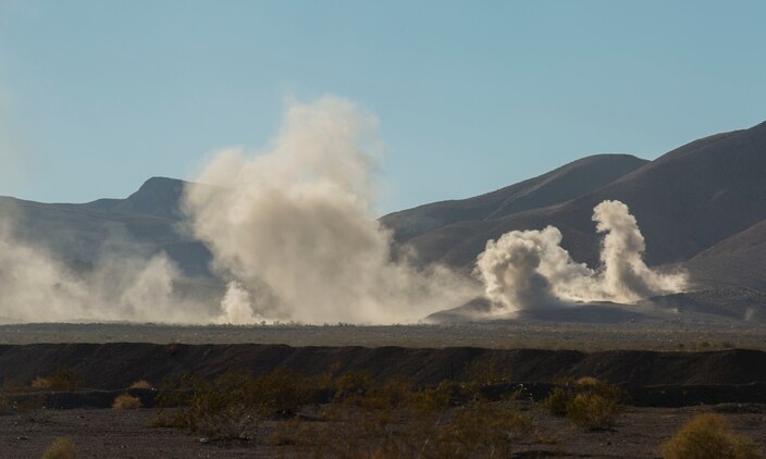 Air and ground combat elements provide suppressing fire for other ground units to move to assault objectives Feb. 9 during the battalion assault course at Marine Air Ground Combat Center Twentynine Palms, California, at Integrated Training Exercise 2-15. The BAC at ITX 2-15 is designed to incorporate all elements of the Special Purpose Marine Air-Ground Task Force Four into one assault. Marines firing artillery, as suppressive fire, are with 1st Battalion, 12th Marine Regiment, 3rd Marine Division, III Marine Expeditionary Force. 