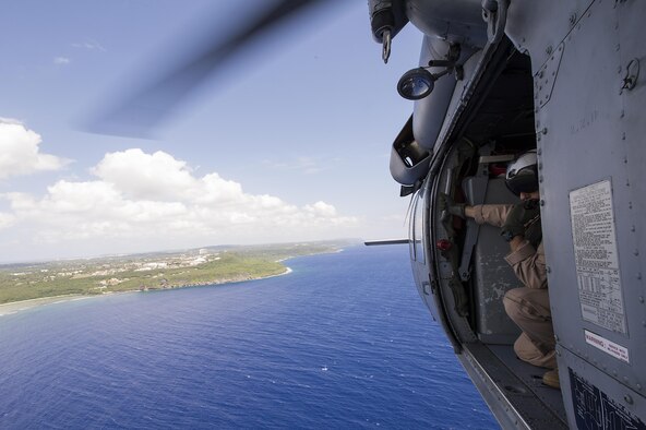 U.S. Naval Aircrewman (Helicopter) Second Class Veditz scans the horizon during a multinational search and rescue exercise at Cope North 15, Feb. 18, 2015, off the coast of Guam. Exercise Cope North 15 enhances humanitarian assistance and disaster relief crisis response capabilities between six nations and lays the foundation for regional cooperation expansion during real-world contingencies in the Asia-Pacific Region. Veditz is from Helicopter Sea Combat Squadron 25. (U.S. Air Force photo/Tech. Sgt. Jason Robertson)
