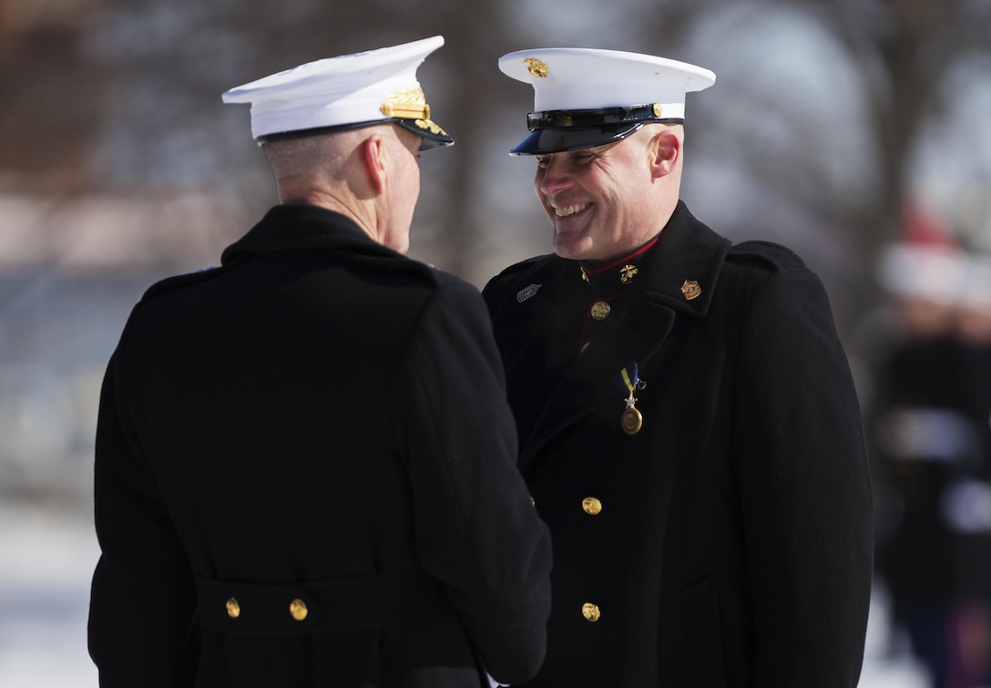 Commandant Gen. Joseph F. Dunford, Jr., congratulates and awards Sgt. Maj. Barrett at the Sgt. Maj. of the Marine Corps relief and appointment ceremony  at Arlington, Virginia, Feb. 20, 2015. The post of Sergeant Major of the Marine Corps was established in 1957 as the senior enlisted advisor to the Commandant of the Marine Corps, the first such post in any of the branches of the United States Armed Forces.