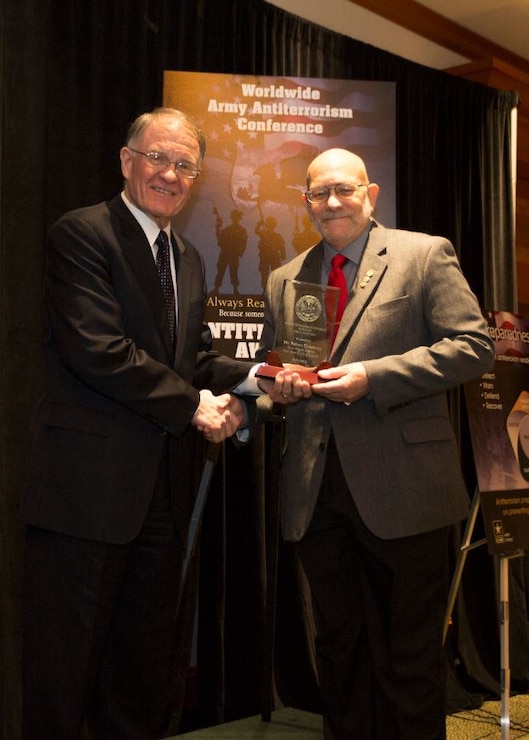 Robert Eisenberg, Antiterrorism Officer, Fort Worth District (right), receives Award for "Best Antiterrorism Program Manager" from Mark Lewis, Army Deputy Chief Management Officer, Office of the Under Secretary of the Army (left) at the 2015 Annual Army Worldwide Antiterrorism Conference.  Forth Worth District also received the "Best Antiterrorism Program -Standalone Facility" award.
