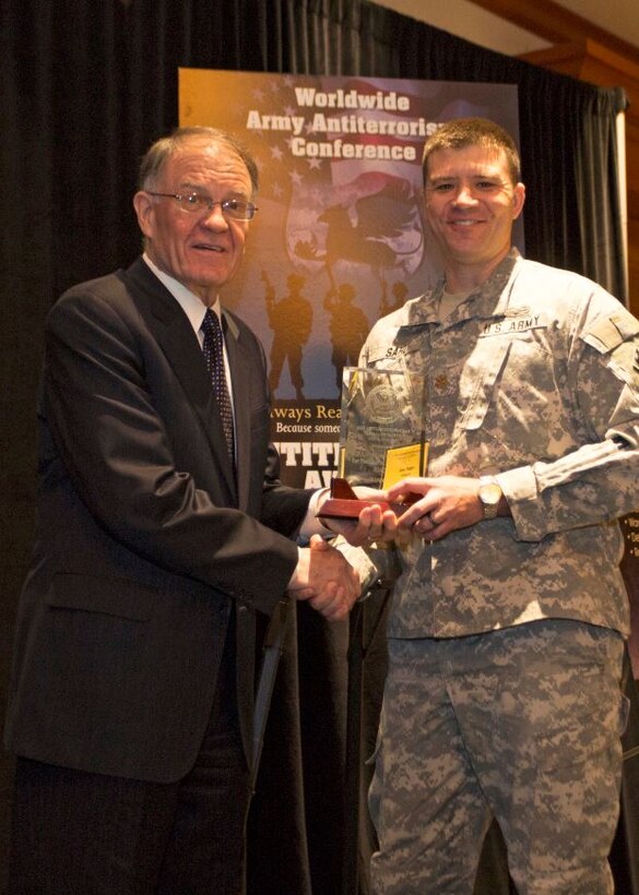 MAJ Joe Sahl (right), Acting Chief, Emergency Management, accepts award for "Best Antiterrorism Program - Standalone Facility" on behalf of Fort Worth District Commander, from Mark Lewis, Army Deputy Chief Management Officer, Office of the Under Secretary of the Army (left) at the 2015 Annual Army Worldwide Antiterrorism Conference.
