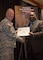 Jermaine March, Antiterrorism Officer, Philadelphia District (right), receives AT Honor Roll Award from MG Mark Inch, Provost Marshal General (left) at the 2015 Annual Army Worldwide Antiterrorism Conference.