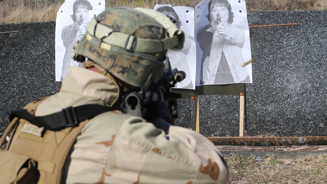 A Marine with 2nd Combat Engineer Battalion, 2nd Marine Division, fires an M4 carbine rifle at a range here, Feb. 10, 2015. Critical Skills Operators with 3rd Marine Special Operations Battalion, U.S. Marine Corps Forces Special Operations Command, trained with 2nd CEB Marines during RAVEN 15-03, a 10-day realistic military training exercise to enhance 3rd MSOB’s readiness for worldwide support to global security. Marines with 2nd CEB played the role of a partner nation force during the exercise. 