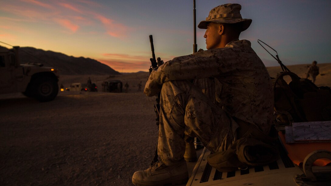 Lance Cpl. Bradley W. Walsh finally gets to relax after a long day of traveling across the rough terrain of the Mojave desert Feb. 12 at Marine Air Ground Combat Center Twentynine Palms, California, during Integrated Training Exercise 2-15. Walsh leads fellow junior Marines during ITX 2-15 as the assistant convoy commander for the jump team. “It’s awesome to get all the responsibility thrown on you,” said Walsh. ITX 2-15 is designed to integrate combined arms and improve war fighting capabilities. Walsh, a Granville, Ohio, native, and rifleman, is with Headquarters Company, 4th Marine Regiment, 3rd Marine Division, III Marine Expeditionary Force.