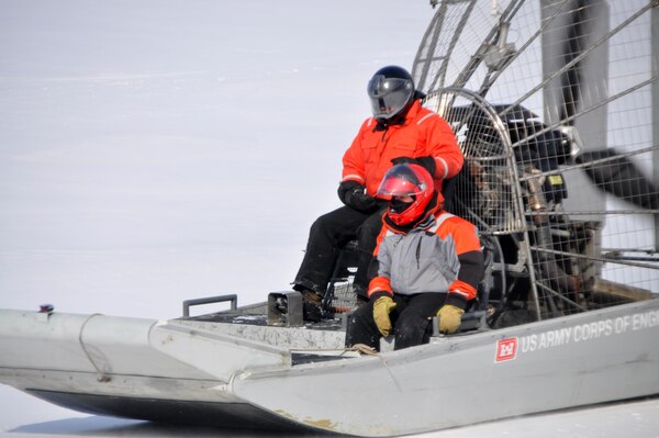Airboat operator Bill Chelmowski and survey technician Kurt Schroeder scoot across frozen Lake Pepin as ice thickness measurements are taken on Feb. 18, 2015. St. Paul District staff from the channels and harbors section took to the ice of Lake Pepin on Feb. 18 for the first of weekly ice thickness measurements. The thickest ice discovered this year was at river miles 771 and 766, where 21 inches were recorded.