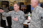 Col. William O'Neill, left, and Command Sgt. Maj. Dennis Green, both of the Virginia National Guard's 29th Infantry Division, discuss the role of the Army National Guard division headquarters in homeland security missions. The two leaders were in New York City for the Army National Guard Division Commander's Conference, hosted by the 42nd Infantry Division.