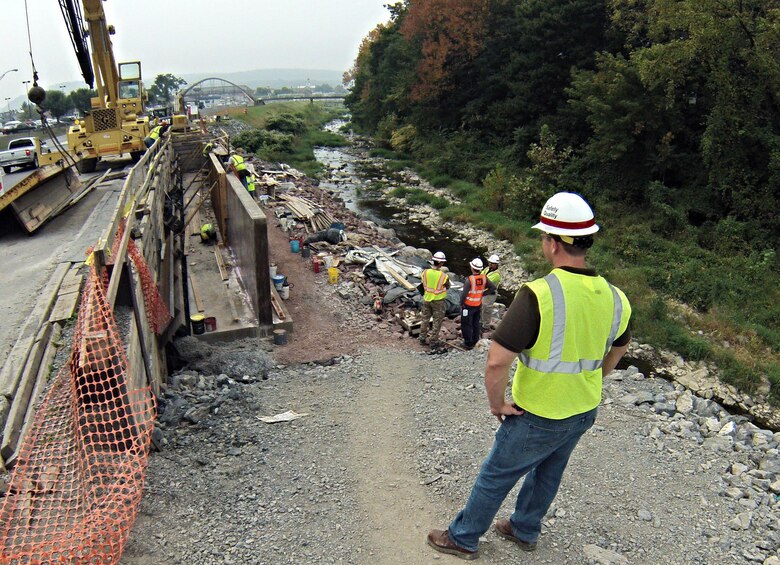 Corps Quality Assurance on site for construction to replace a portion of retention wall along Mahoning Creek and State Route 54 in the Borough of Danville, Penn, Sept. 30, 2014. Approximately 90 feet of this wall was compromised during Tropical Storm Lee in 2011. The replacement work is was performed by the U.S. Army Corps of Engineers, Baltimore District, under the authority of Public Law (P.L.) 84-99, Flood Control and Coastal Emergency Act. 