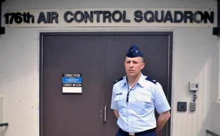 Capt. Erik Boltman an air weapons officer with the 176th Air Control Squadron, Alaska Air National Guard, works as a combat air traffic controller at Elmendorf Air Force Base, Alaska June 7, 2010. 