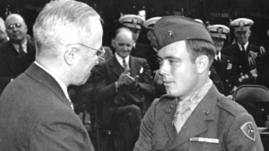Harry Truman, president of the United States, congratulates Hershel "Woody" Williams, a Marine reservist and survivor of the battle of Iwo Jima, on being awarded the Medal of Honor for his actions during the battle of Iwo Jima October 5, 1945 at the White House in Washington. Williams is the last living Medal of Honor recipient from the battle of Iwo Jima.