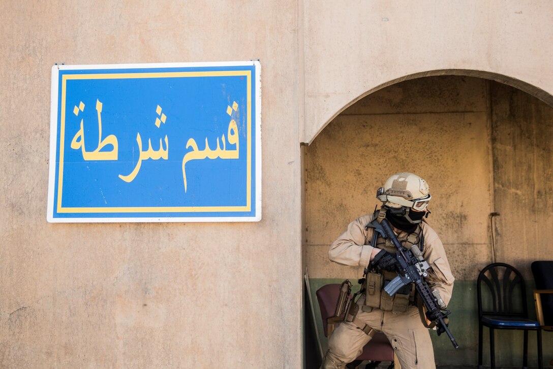 A U.S. Marine with the 15th Marine Expeditionary Unit’s Force Reconnaissance Detachment provides security during military operations in urban terrain training aboard Camp Pendleton, Calif., Feb. 19, 2015. These Marines are a part of the MEU’s Maritime Raid Force. The training provides the MEU with the opportunity to train for similar environments in preparation for their upcoming deployment. (U.S. Marine Corps photo by Sgt. Emmanuel Ramos/Released)