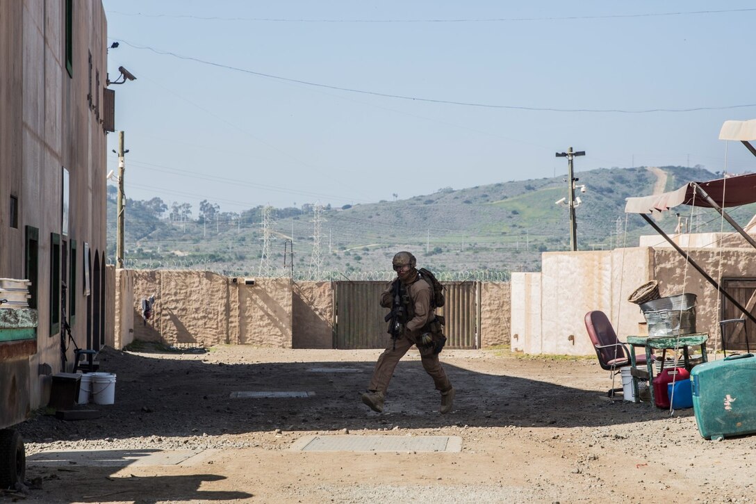 A U.S. Marine with the 15th Marine Expeditionary Unit’s Force Reconnaissance Detachment makes his way toward an objective during military operations in urban terrain training aboard Camp Pendleton, Calif., Feb. 19, 2015. These Marines are a part of the MEU’s Maritime Raid Force. The training provides the MEU with the opportunity to train for similar environments in preparation for their upcoming deployment. (U.S. Marine Corps photo by Sgt. Emmanuel Ramos/Released)