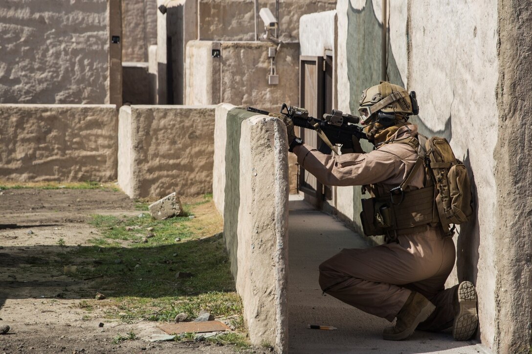 A U.S. Marine with the 15th Marine Expeditionary Unit’s Force Reconnaissance Detachment provides security during military operations in urban terrain training aboard Camp Pendleton, Calif., Feb. 19, 2015. These Marines are a part of the MEU’s Maritime Raid Force. The training provides the MEU with the opportunity to train for similar environments in preparation for their upcoming deployment. (U.S. Marine Corps photo by Sgt. Emmanuel Ramos/Released)