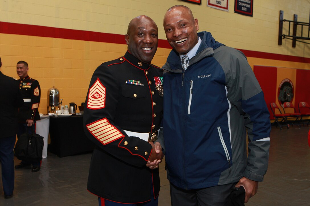 A reception for the Sergeant Major of the Marine Corps Relief and Appointment Ceremony is held at the Cpl. Terry L. Smith Gym on Joint Base Myer-Henderson Hall, Va., Feb. 20, 2015. During the Ceremony Sgt. Maj. Micheal P. Barrett, the 17th Sergeant Major of the Marine Corps, retired and relinquished his post to Sgt. Maj. Ronald L. Green, the 18th Sergeant Major of the Marine Corps. (U.S. Marine Corps photo by Sgt. Marionne T. Mangrum.)
