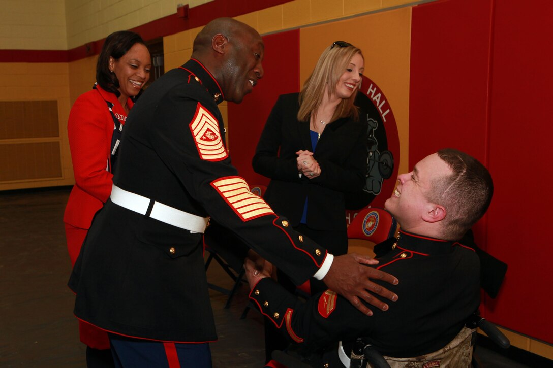 A reception for the Sergeant Major of the Marine Corps Relief and Appointment Ceremony is held at the Cpl. Terry L. Smith Gym on Joint Base Myer-Henderson Hall, Va., Feb. 20, 2015. During the Ceremony Sgt. Maj. Micheal P. Barrett, the 17th Sergeant Major of the Marine Corps, retired and relinquished his post to Sgt. Maj. Ronald L. Green, the 18th Sergeant Major of the Marine Corps. (U.S. Marine Corps photo by Sgt. Marionne T. Mangrum.)