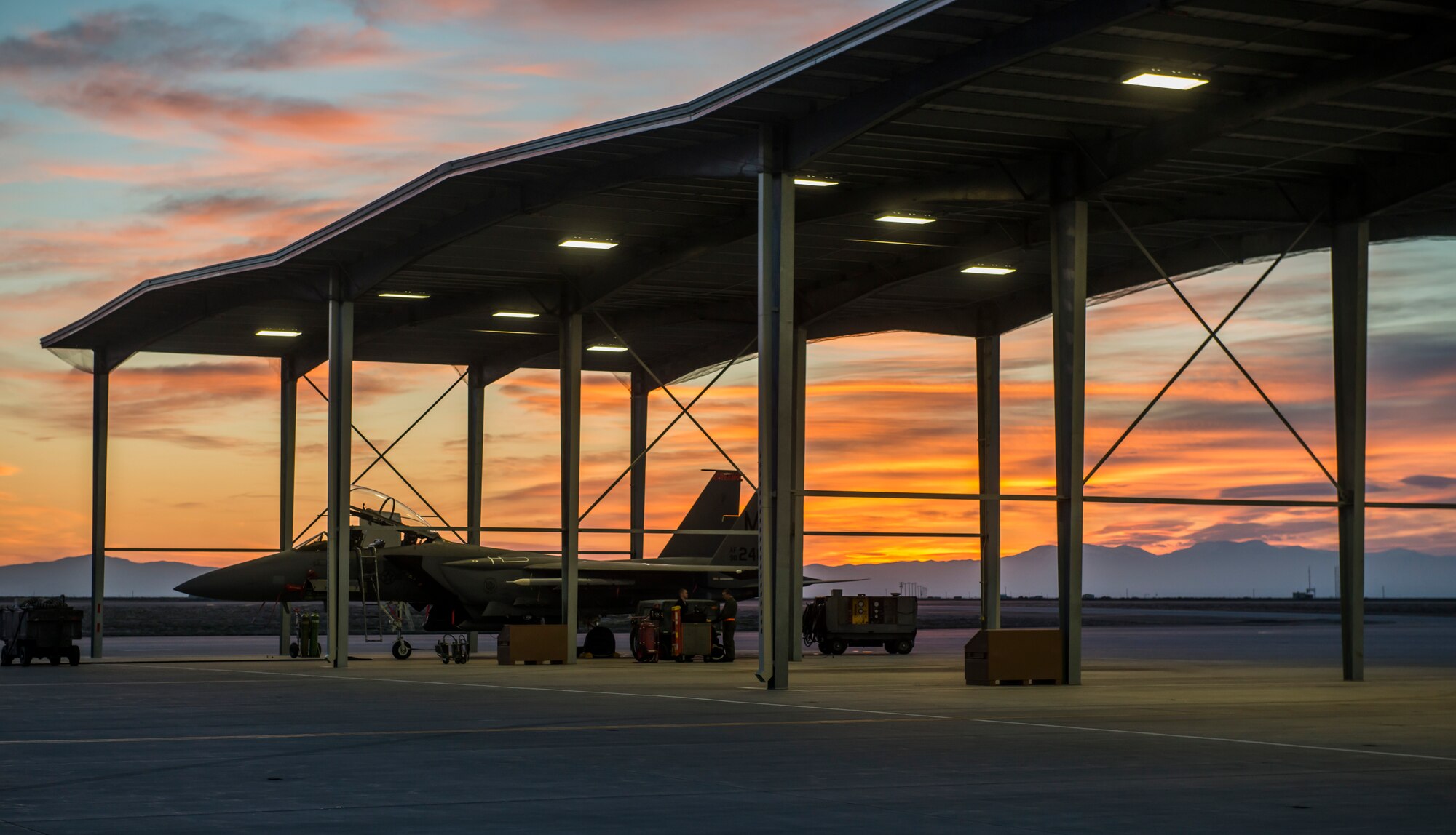 Newly added overhead lights illuminate the Aircraft beneath for Maintainers from the 391st Bold Tigers squadron at Mountain Home Air Force Base, Idaho Feb. 19, 2015. "It's definitely a morale boost to be able to see what you're doing without a headlamp or a flashlight in your hand," said Senior Airman Dillon Stroup, 391st weapons loadcrew member. "The lights were a much needed improvement." (U.S. Air Force photo by Airman Connor J. Marth/RELEASED)