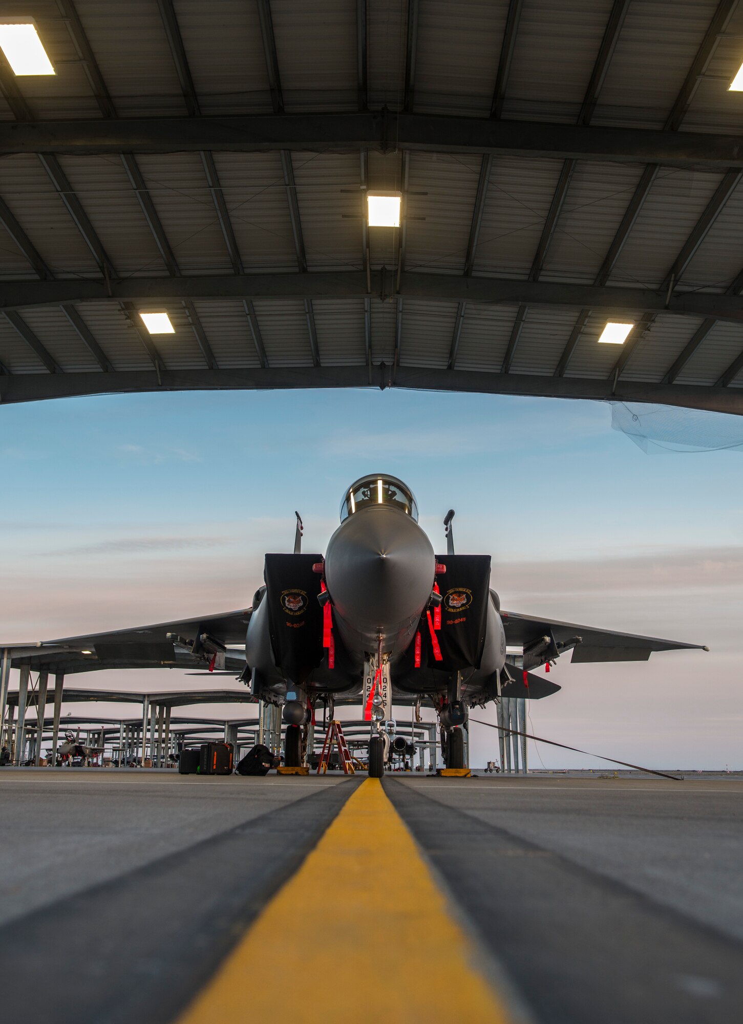 An F-15E Strike Eagle, assigned to the 391st Bold Tigers, sits on the flightline at Mountain Home Air Force Base, Idaho Feb. 19, 2015. New lights in the aircraft shelter illuminate the aircraft for maintainers and aircrew members who work in the late hours of the day.(U.S. Air Force photo by Airman Connor J. Marth/RELEASED)