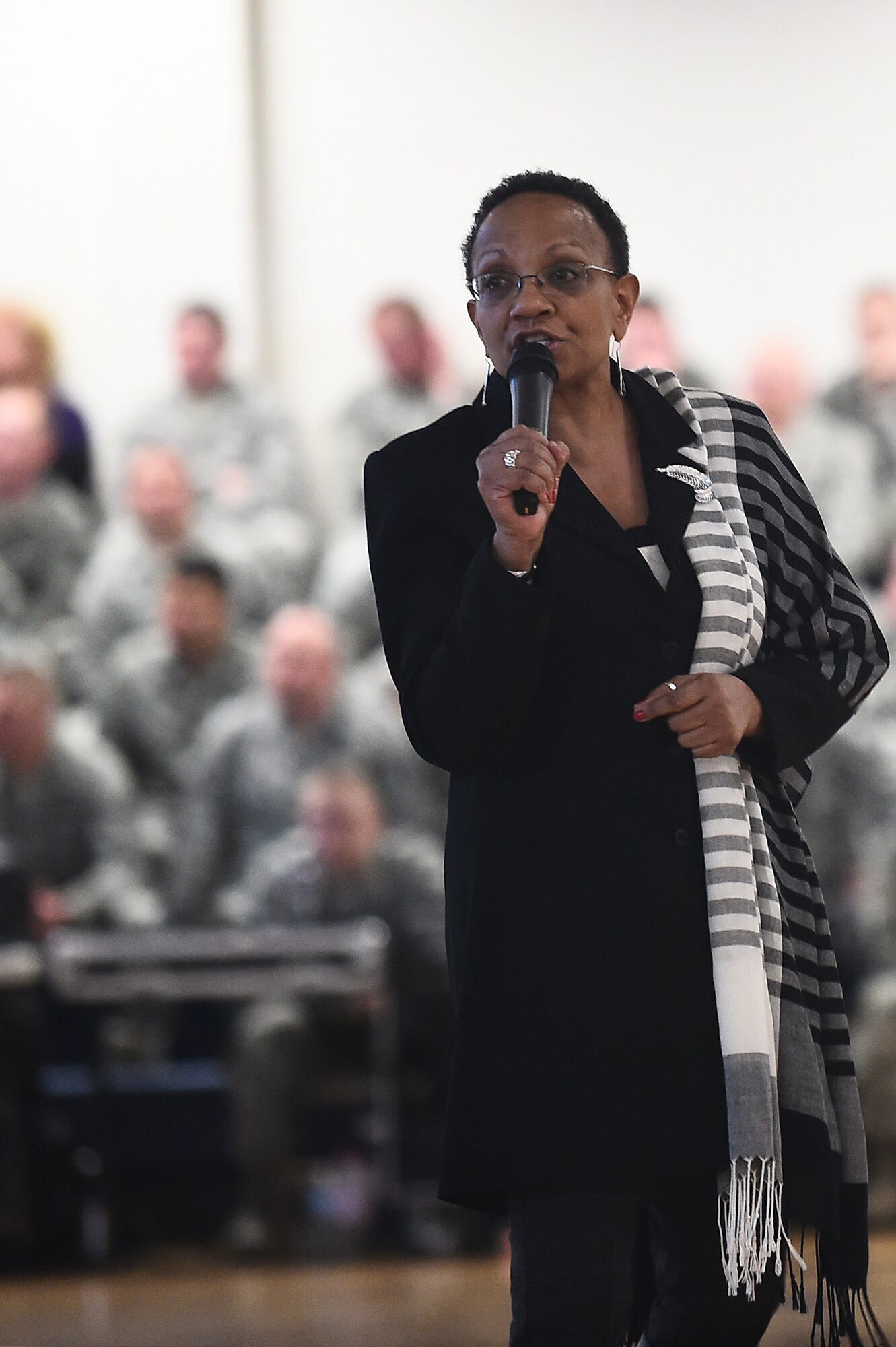 Peggy Moore-McCoy, Buckley’s Sexual Assault Response Coordinator, speaks during the commander’s call on the gains made in the prevention and reporting of sexual assault on Feb. 19, 2015, at Buckley Air Force Base, Colo. Moore-McCoy highlighted a statistic that showed the number of reported sexual assaults has gone from 1 in 6 people reporting their sexual assault, to now 1 in 3 people reporting. (U.S. Air Force photo by Airman 1st Class Luke W. Nowakowski/Released)