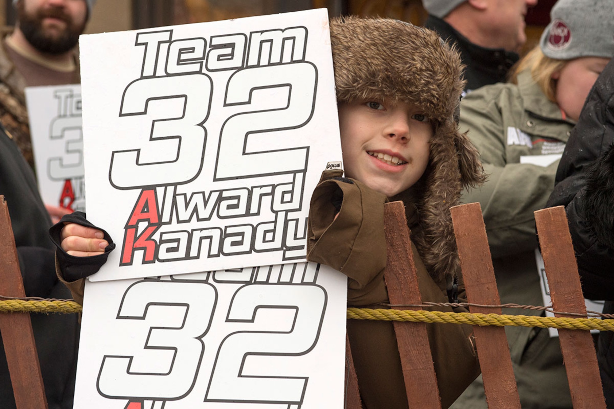 Tayson Mckenzie, an 11 year old spectator, shows his support for family friends participating in the 2015 Iron Dog race in Anchorage, Alaska, Feb. 21. The race course is 2,000 miles long and passes through Joint Base Elmendorf-Richardson. (U.S. Air Force photo/Alejandro Pena)