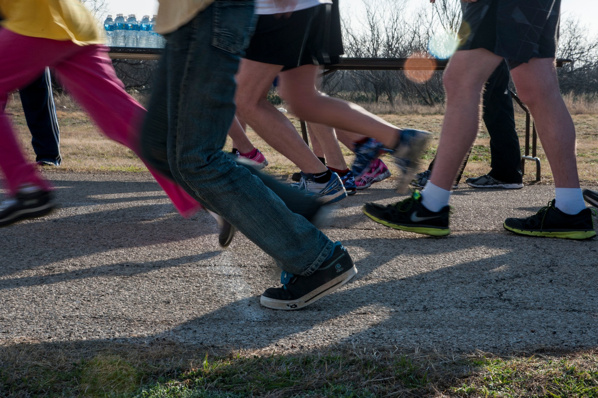 GOODFELLOW AIR FORCE BASE, Texas -- Runners cross the starting line during the Heart Healthy 5k on Kiowa Trail Feb. 21. The event promoted healthy habits by encouraging families to engage in activity as part of the Heart Healthy Month. (U.S. Air Force photo/ Senior Airman Michael Smith)	