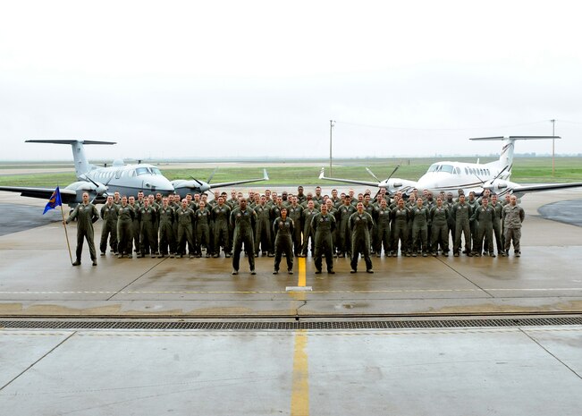 The 306th Intelligence Squadron poses for a group photo Feb. 20, 2015, at Beale Air Force Base, Calif. The Air Force recently announced the Airborne Intelligence, Surveillance, and Reconnaissance Operators were selected as the 2015 Air Force Association Team of the Year. Beale’s 306th Intelligence Squadron is the home to approximately 150 Airborne ISR Operators, who specialize as Tactical System Operators. (U.S. Air Force photo by Sean Bhakta/Released)
