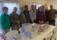 Members from Dorm to Gourm, Dover Air Force Base, Code Purple and the Kent County Levy Court worked to prepare meals for Code Purple shelters Feb. 18, 2015. The Dorm to Gourm students meet twice a month and learn to cook healthy meals on a budget. The Dorm to Gourm program is run by Dawne Nickerson-Banez, Frankfurt Bakery & Deli owner. Students went to the shelter to present the meals they prepared. (Courtesy photo)