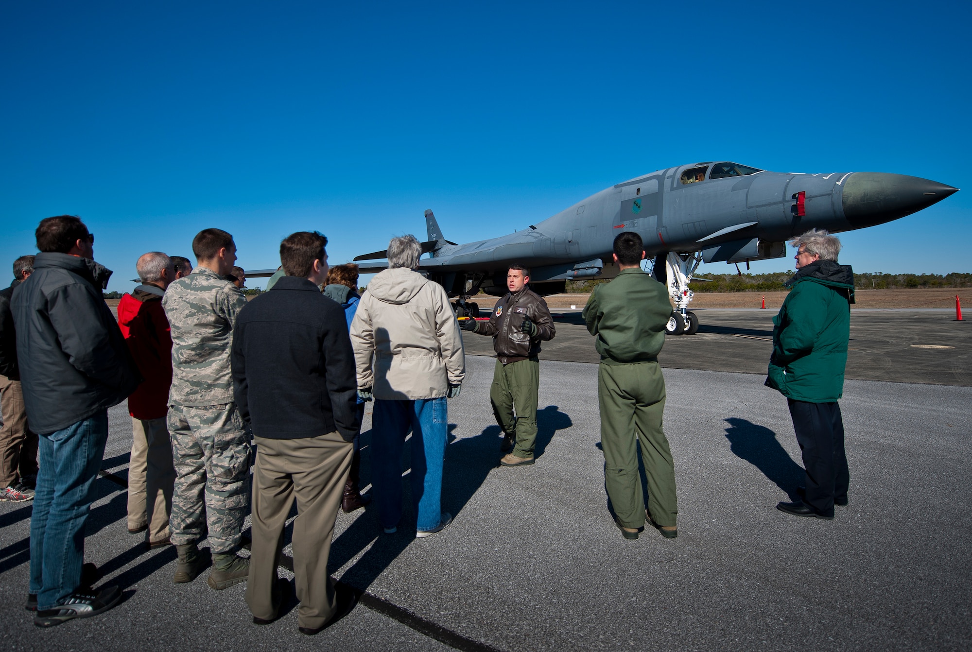 Maj. Dominic Ross, 337th Test and Evaluation Squadron, briefs 53rd Wing members on the B-1B Lancer during a tour of the aircraft Feb. 19 at Eglin Air Force Base, Fla.  The bomber from Dyess AFB, Texas was here for a few missions and to allow wing personnel an opportunity to see one of their geographically separated aircraft up close.  (U.S. Air Force photo/Samuel King Jr.)