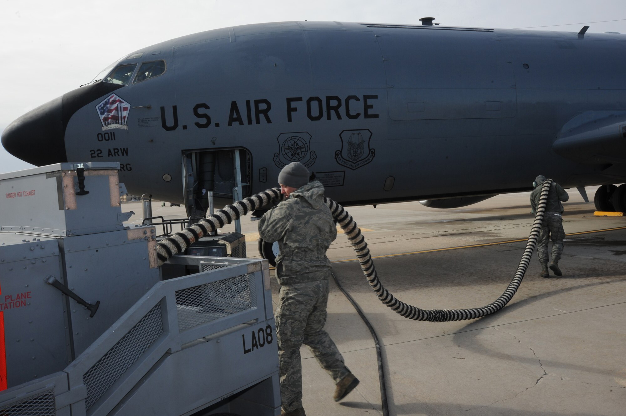 Senior Airman Charles Boehr, 22nd Aircraft Maintenance Squadron crew chief, adjusts a hose from an air compression cart during a flight control check, Feb. 18, at McConnell Air Force Base, Kan. The air compressor powers the jets to ensure they operate properly before McConnell’s aircraft are flight ready. (U.S. Air Force photo by Airman 1st Class Christopher Thornbury)