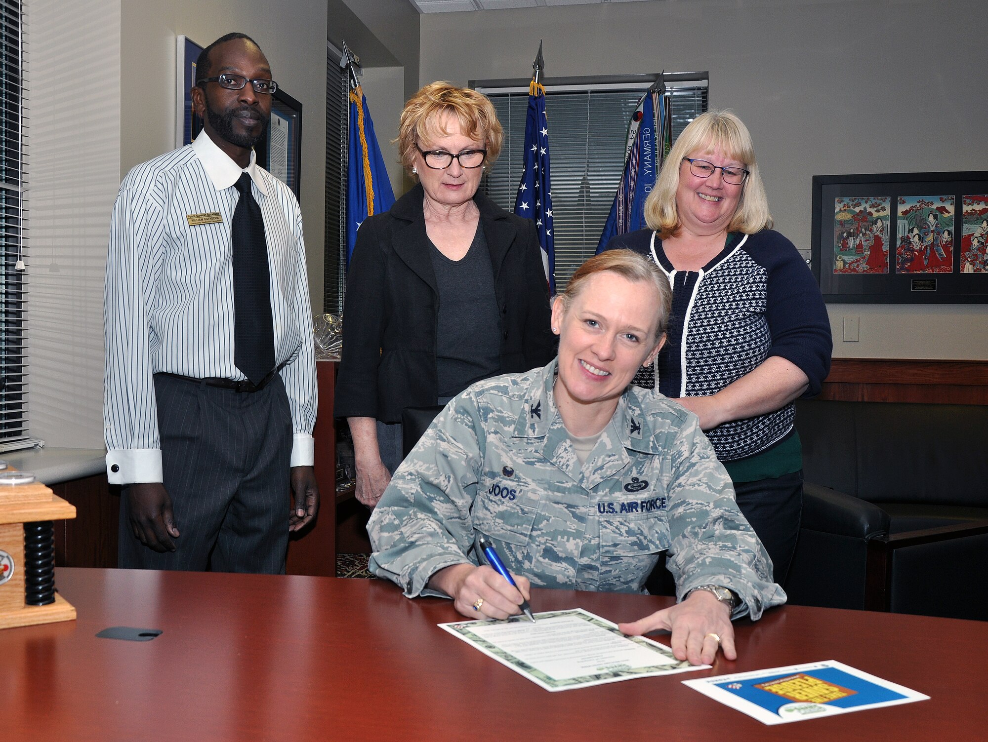 GOODFELLOW AIR FORCE BASE, Texas – Col. Kimberlee P. Joos, 17th Training Wing Commander, signs the Military Saves Week proclamation at the Norma Brown Building, Feb. 23. Military Saves Week runs from Feb. 23 to 28. During this time, the Airman and Family Readiness Center is offering several classes to help individuals manage their finances. (U.S. Air Force photo/ Senior Airman Joshua Edwards)