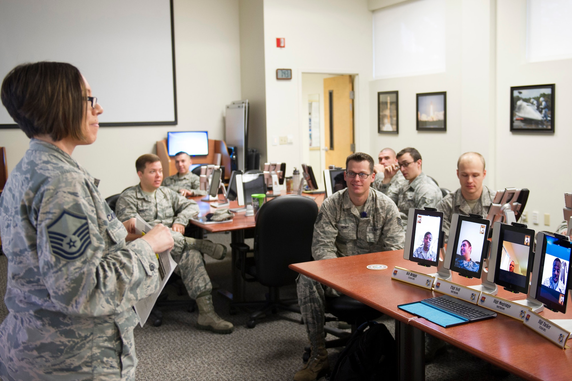 During the first trial of the virtual classroom, MSgt Monica Carranza, public health 45th Medical Group, fills in as team lead and introduces the guest speaker at an Informed Decision Seminar for Airman who are within 15 months of their current separation date at the Patrick Air Force Base Professional Development Center Feb. 11, 2015. (U.S. Air Force photo/Matthew Jurgens)