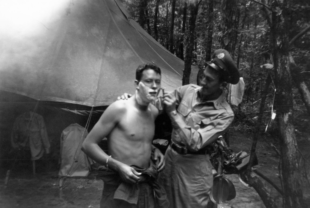 1951 bivouac to Cedars of Lebanon State Park, Lebanon, Tennessee; Troy Brotherton is shaving Unknown individual. (Photo by NCANG Heritage Program)