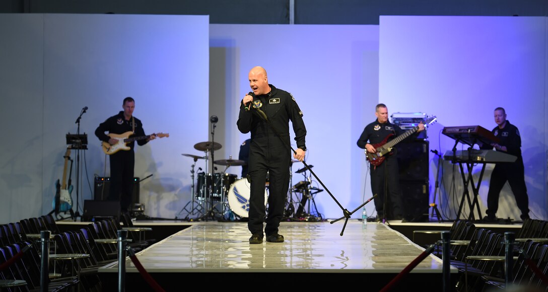Senior Master Sgt. Ryan Carson, U.S. Air Force Band Max Impact vocalist, performs at Fan Fest in Scottsdale, Arizona.  The week-long entertainment, food, and fashion event is home to Entertainment Sports and Programming Network's Live Broadcast for Super Bowl XLIX (U.S. Air Force photo by Senior Airman Nesha Humes/released)

