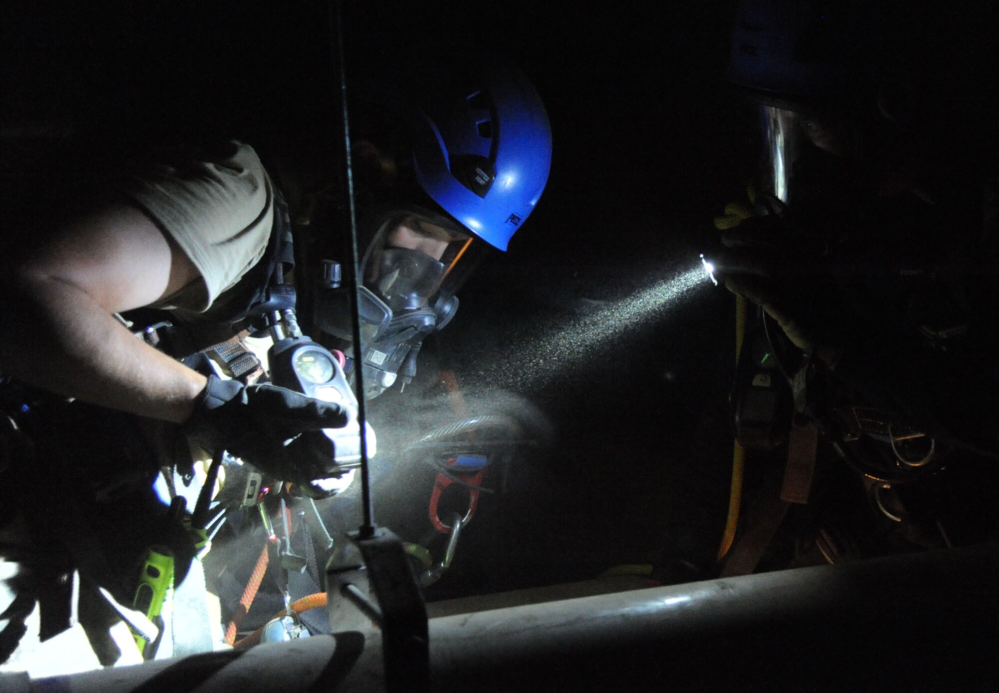 Senior Airman Aaron White, 81st Infrastructure Division firefighter, inspects his regulator  air pressure level during confined space rescue operations training Feb. 13, 2015, at the medical center, Keesler Air Force Base, Miss.  Keesler hosted the one-time advanced rescue certification training course, which consisted of confined space rescue, high and low angle rescue and stokes basket rescue operations.  Eleven students from four bases completed the course.  (U.S. Air Force photo by Kemberly Groue)